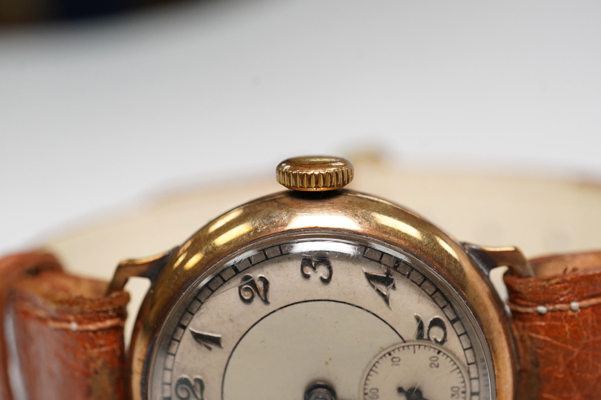 A gentleman's 1930's 9ct gold manual wind wrist watch, with Arabic dial and subsidiary seconds, case diameter 29mm, on a later leather strap. Condition - poor